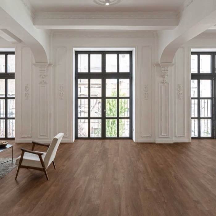 Rich walnut engineered wood flooring in a luxurious modern living room