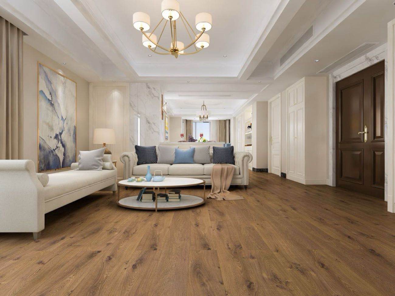 Warm wood-look waterproof laminate flooring in a bright modern living room by Oceanus Flooring
