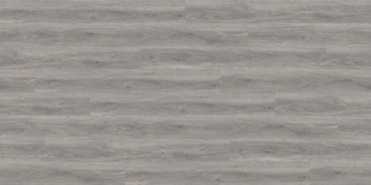 Dry back glue-down vinyl plank flooring in a warm oak tone
